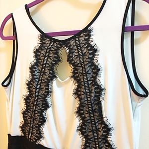 Black and white sleeveless lace dress